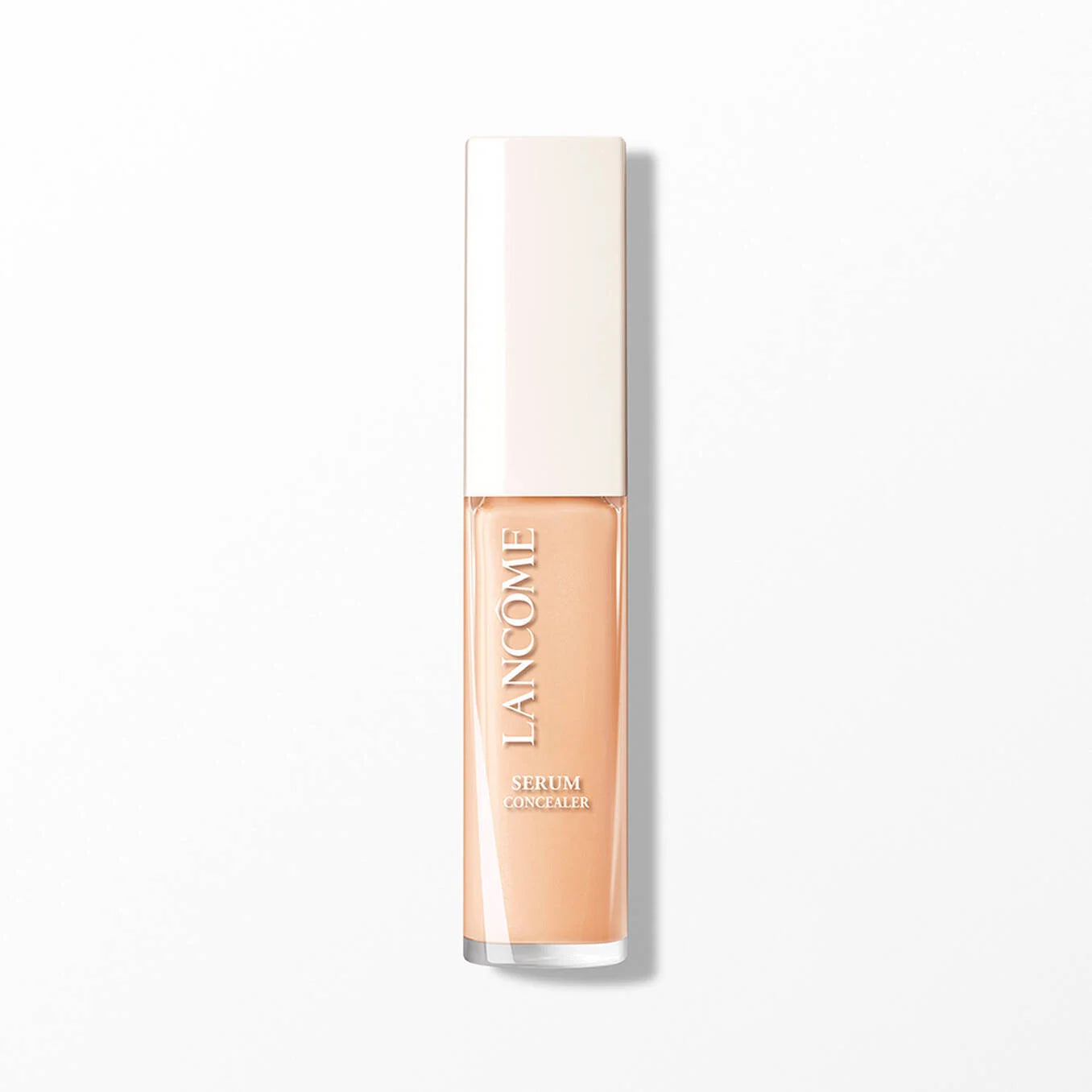 Rectangular clear bottle of light peach concealer with a cream cap. 'LANCOME SERUM CONCEALER' printed vertically.