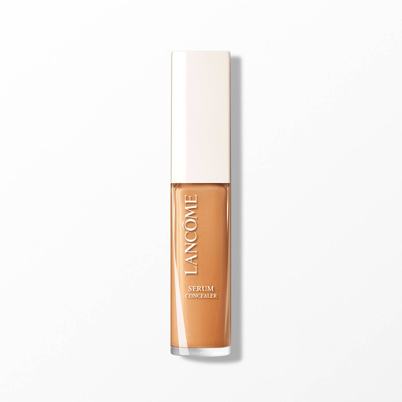 Lancome serum concealer in a rectangular transparent tube with a white cap, showing a medium brown liquid.