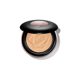 Partially open black compact with rose-gold-toned trim. Fair pressed powder with swirls inside. Embossed rose logo on the lid
