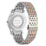 Back view of a silver-toned watch with a round case and a two-toned metal bracelet with alternating silver-toned and rose-gol