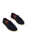 Pair of navy suede loafers with cream rubber soles. Features visible dark blue stitching on the toe and small brown leather s