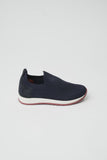 Dark blue slip-on sneaker with knitted mesh upper, ribbed details, suede heel patch, white midsole, and reddish-brown outsole