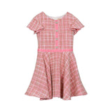 Front view of a David Charles girls' pink tweed dress featuring gold metallic threads, jewel-encrusted buttons, and a pink velvet waistband.