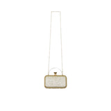 Rear view of a David Charles gold glitter box clutch with a gold-tone top handle and long chain shoulder strap.