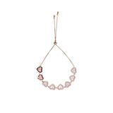 David Charles girls rose gold bolo bracelet featuring seven mother-of-pearl hearts with crystal borders on a white background.