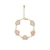David Charles girls rose gold bolo bracelet featuring seven mother-of-pearl hearts with crystal borders on a white background.
