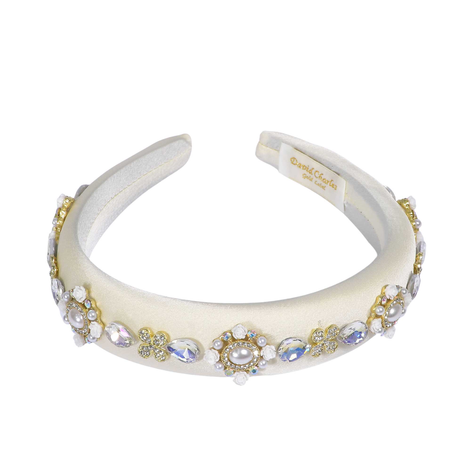 Detailed view of the inner lower base of the headband, showing the gathered white elasticated fabric panel designed for a comfortable fit.