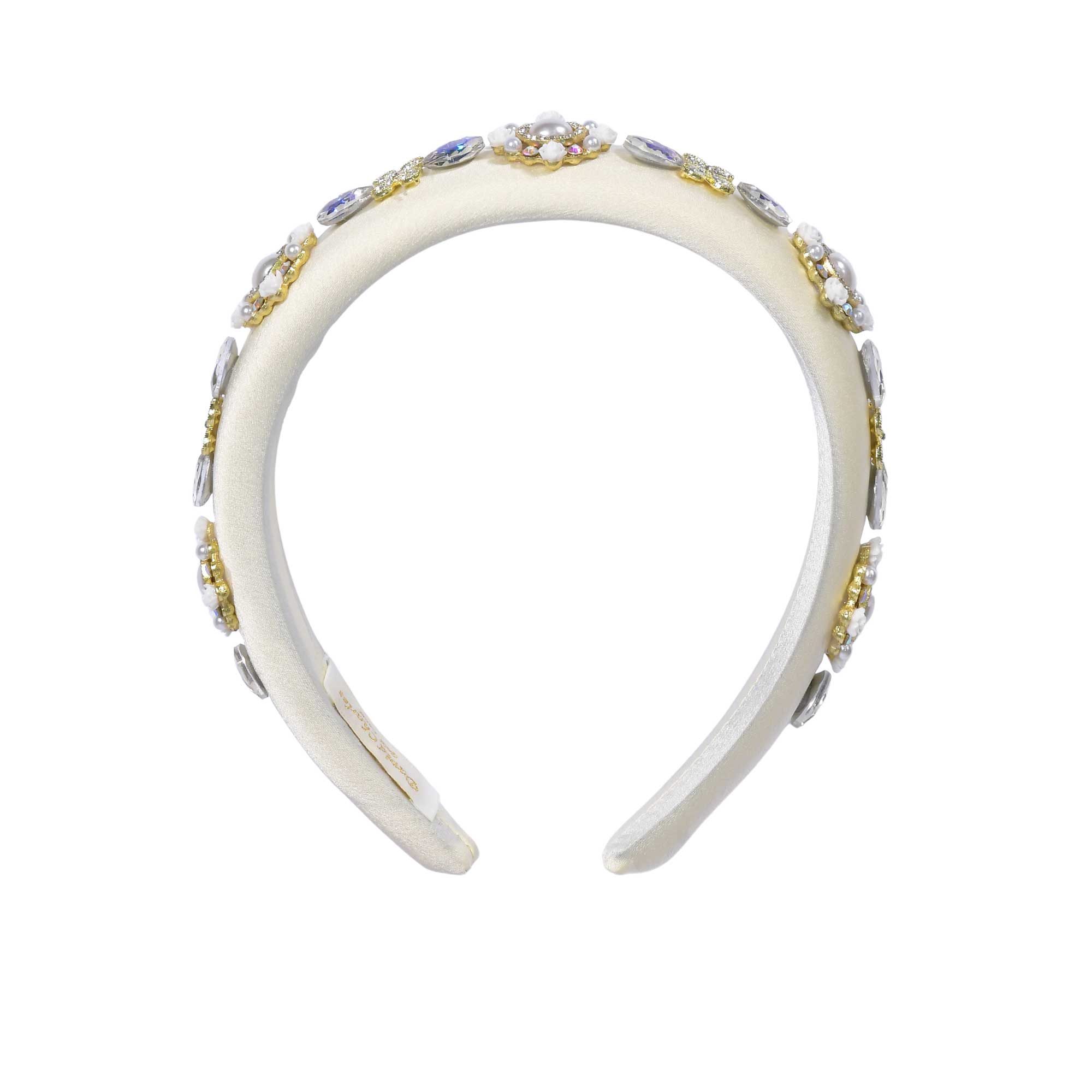 Front view of the David Charles white cotton poplin headband, showcasing the vibrant, colorful Carretto geometric pattern and central top knot.
