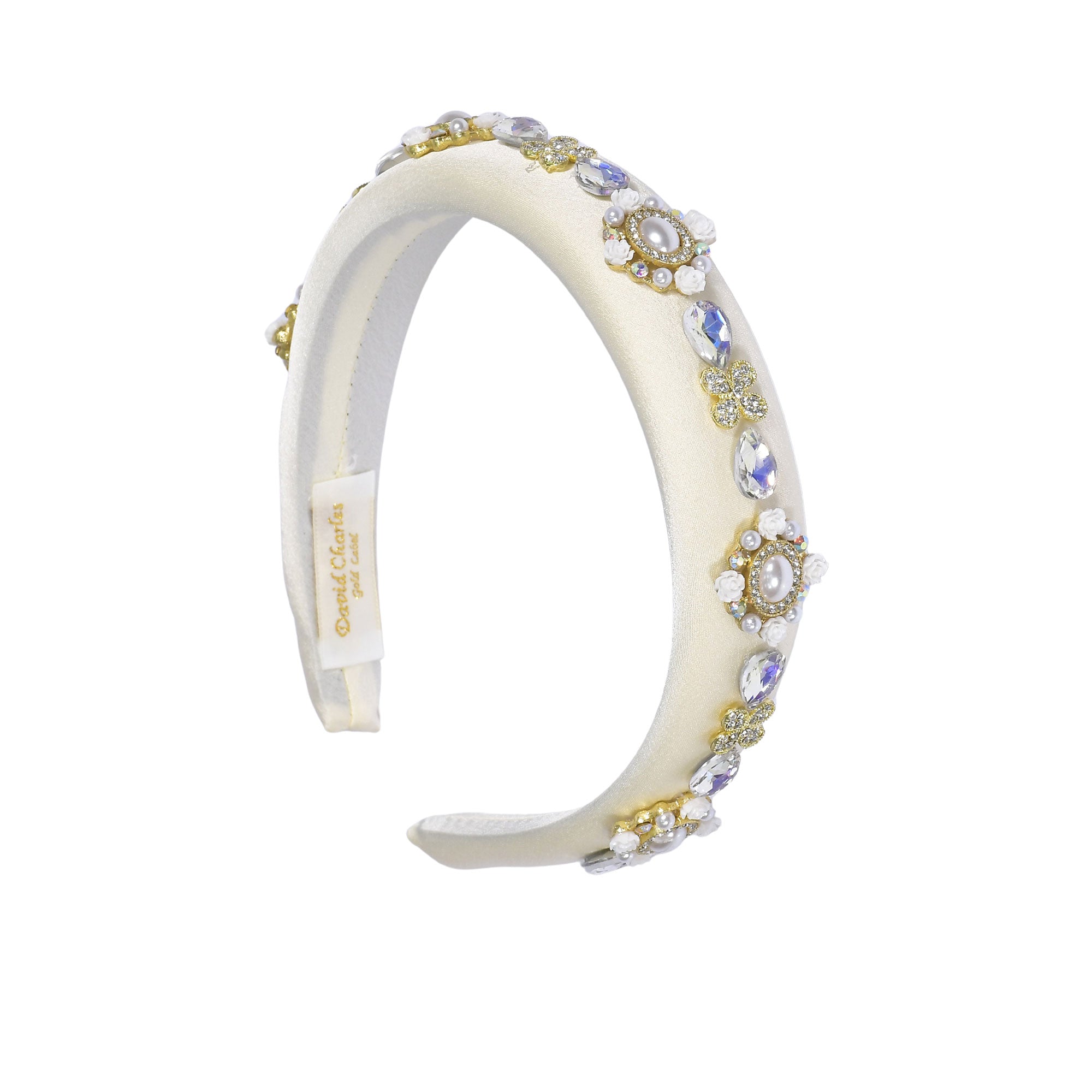 Side view of the David Charles girls' headband, highlighting the curve of the flexible band and the continuous multicolor print