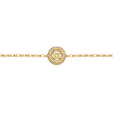 A direct flat close-up shot focusing on the central station of the Escada Alice bracelet, highlighting the cutout back-to-back EE logo encircled by rows of pavé-set clear crystals.