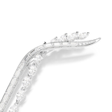 A detailed macro close-up of the upper curve of the Swarovski Mesmera brooch, emphasizing the flawless alignment of the geometric baguette stones and the tapered marquise crystal accents along the polished border.