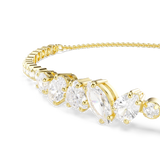 A detailed macro close-up shot focusing on the central setting of the Swarovski Mesmera bracelet, emphasizing the precise prong settings, sharp facets, and brilliant internal fire of the oval, pear, and marquise white crystals.
