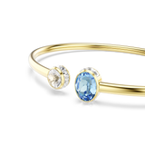A detailed macro close-up shot focusing on the terminals of the Swarovski Chroma bangle, highlighting the rich faceting of the central blue oval and clear round crystals framed by miniature rectangular clear crystal borders.