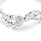 detailed macro close-up shot of the Swarovski Mesmera bracelet set against a solid black background, emphasizing the exceptional facet work, crisp prongs, and internal fire of the mixed baguette and marquise crystals.
