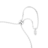 A macro close-up view of the Swarovski Mesmera bracelet's sliding mechanism, showcasing the polished rhodium bead, the parallel delicate chains, and the dangling octagonal tag engraved with the signature swan logo.