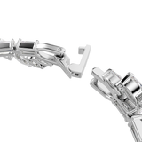 A macro close-up view of the Swarovski Mesmera bracelet's integrated fold-over clasp, displaying the high-shine silver-tone metal finish and the discreetly engraved Swarovski branding.