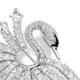 A detailed macro close-up of the Swarovski Vienna brooch focusing on the crystal-pave swan head, the delicate black enamel beak accent, and the precise geometric setting of the fanning crystal rows.