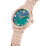 A close-up, three-quarter perspective studio shot of the Swarovski Imber watch set against a stark black background, emphasizing the iridescent green mother-of-pearl dial texture and the intense sparkle of the crystal-embellished bracelet links.