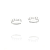 Pair of silver-toned open-hoop ear cuffs, each adorned with five clear, round, brilliant-cut stones.