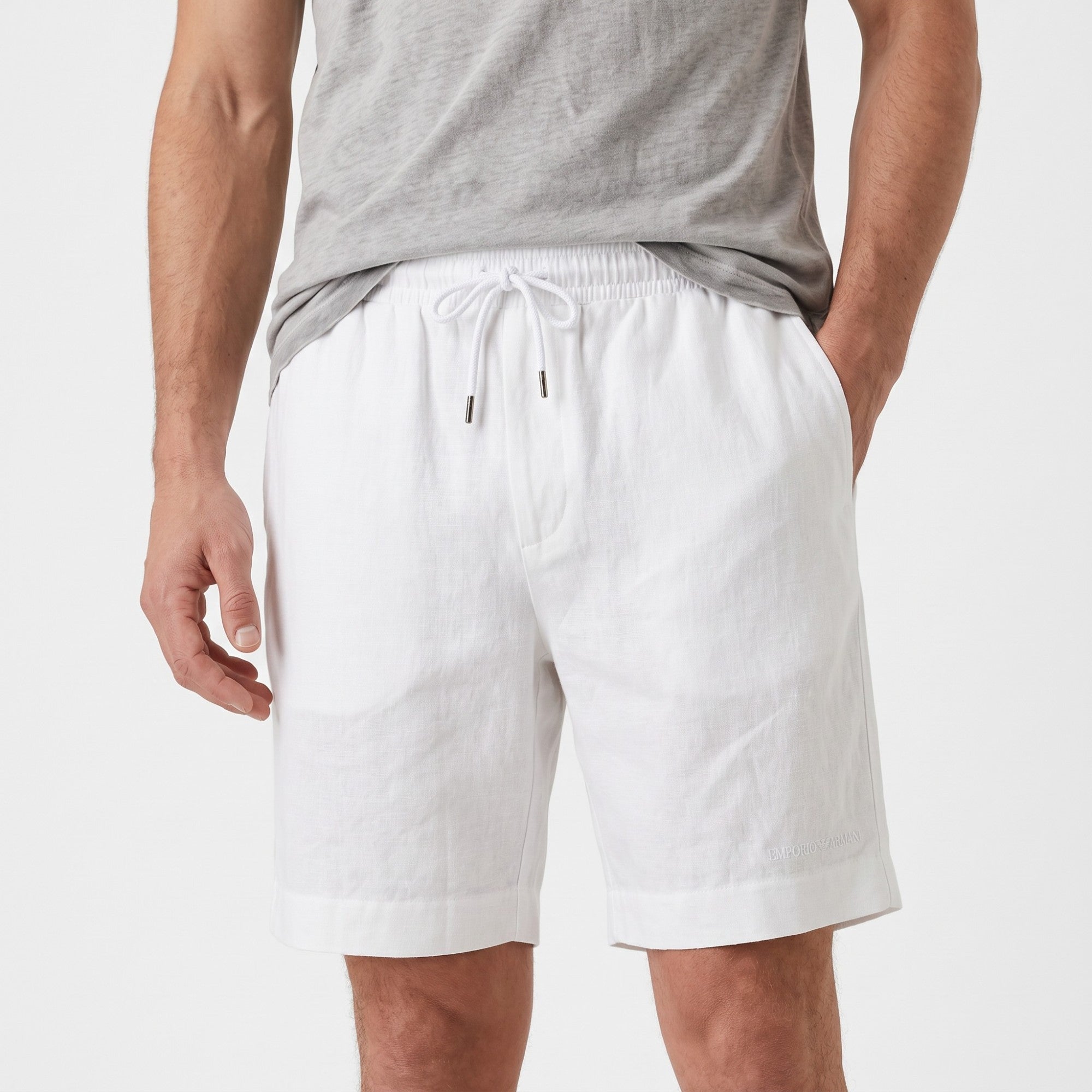 White men's relaxed-fit Bermuda shorts with an elasticated drawstring waist, side pockets, and cuffed hem.