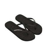 Black flip-flops. Left flip-flop strap: 'EMPORIO ARMANI'. Right flip-flop strap: 'EA'. Footbeds have embossed 'EA' logo.