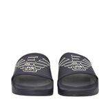 Pair of black rubber slides with a wide strap featuring a white outlined eagle logo with 'GA' on each.
