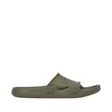 Olive green molded rubber slide slipper with a wide strap featuring a dark logo and rectangular indentations on the sole's si