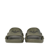 Olive green rubber slide slippers with a wide strap and dark grey eagle logo. Footbed has a textured honeycomb pattern.