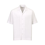 Textured white short-sleeved shirt with a resort collar, button-front, and subtle embroidered logo on the left chest.