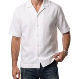 White men's short-sleeved linen shirt with a Cuban collar, button-front, and embroidered text on the chest.