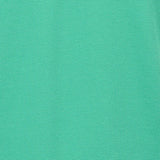 Emerald green polo shirt fabric with a visible pique knit texture.