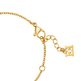 Gold-toned bracelet with a lobster clasp, a fine cable chain, an extender chain with oval links, and a rectangular logo charm