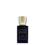 A luxury bottle of Ex Nihilo Lust in Paradise Extrait de Parfum. The rectangular bottle is made of deep midnight-blue transparent glass with a gold-bordered label featuring the brand and fragrance name in gold typography. It is topped with a heavy, intricately textured gold cap, set against a seamless white background.