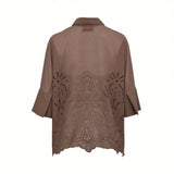 Back studio shot of the brown ERMANNO FIRENZE linen blouse, highlighting the continuous ornate eyelet embroidery pattern and scalloped hem.