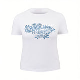 Front studio shot of a white ERMANNO FIRENZE women's crew-neck t-shirt featuring an indigo-blue floral graphic and brand logo on the chest.