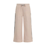 Beige wide-leg jogging pants with an elastic waist, grey drawstring tied in a bow, and dark side stripes.