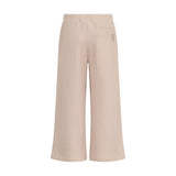 Beige wide-leg jogging pants with an elastic waistband, a single back pocket on the right, and a small fabric tag.