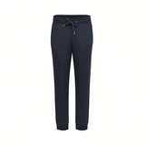 Front studio shot of men's Eden Park jogger sweatpants in navy blue, showcasing the elastic drawstring waistband and a sleek, tapered leg silhouette.