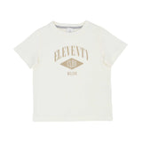 Close-up of off-white T-shirt with gold "Eleventy Club Milano" graphic print.