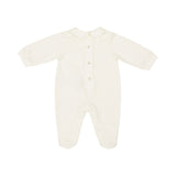 Back view of an ivory cotton baby romper illustrating the neat collar line and three polished snap-button fasteners along the center upper back.