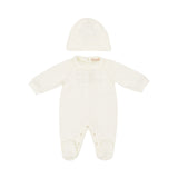Full front view of a two-piece baby set by Elisabetta Franchi featuring an off-white long-sleeved romper with feet and a matching beanie with an embroidered logo.