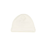 Back view of a minimalist off-white baby beanie showing clean stitching lines and a smooth, comfortable fabric panel.