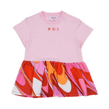 A pink short-sleeved baby dress by Pucci with three shoulder snaps, featuring a multi-colored embroidered logo on the chest and a swirling orange, pink, and red patterned skirt.