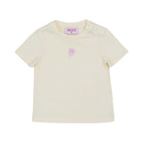 Close-up of the Emilio Pucci cream t-shirt with a pink fish emblem and shoulder snap buttons