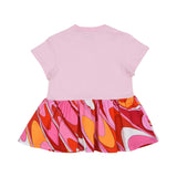 Back view of pink short-sleeved baby dress by Pucci with three shoulder snaps, featuring a multi-colored embroidered logo on the chest and a swirling orange, pink, and red patterned skirt.