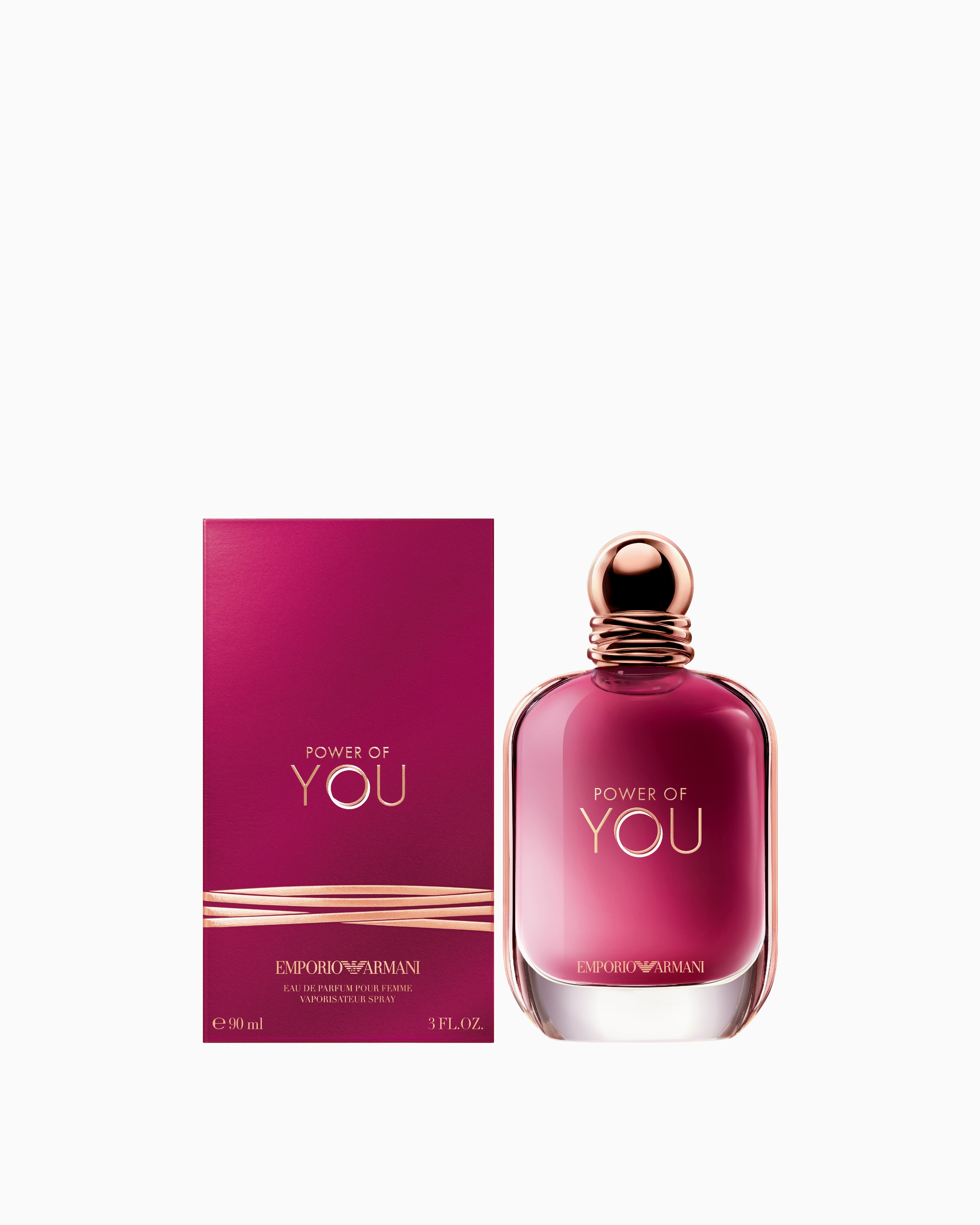 Full frontal perspective of the Emporio Armani Nature fragrance bottle, highlighting its minimalist circular design and gold branding.