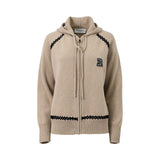 ERMANNO FIRENZE beige knit zip-up hoodie featuring black lattice embroidery on the shoulders and hem, a drawstring hood, and a sequined "E" logo patch on the chest.