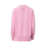 A long-sleeved pink Ermanno Firenze sweater featuring a deep V-neckline decorated with intricate pink floral lace embroidery against a white background.