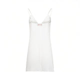 Back view of the detachable white inner slip lining showing the adjustable shoulder strap hardware, available at BLUE SALON shop.