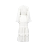 Back view of the Ermanno white maxi dress highlighting the smocked elastic waist and detailed lace trim tiered paneling, available at BLUE SALON shop.
